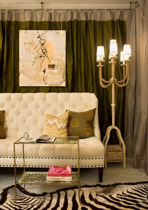 Tricia Huntley living room with animal print rug and tufted couch.jpg